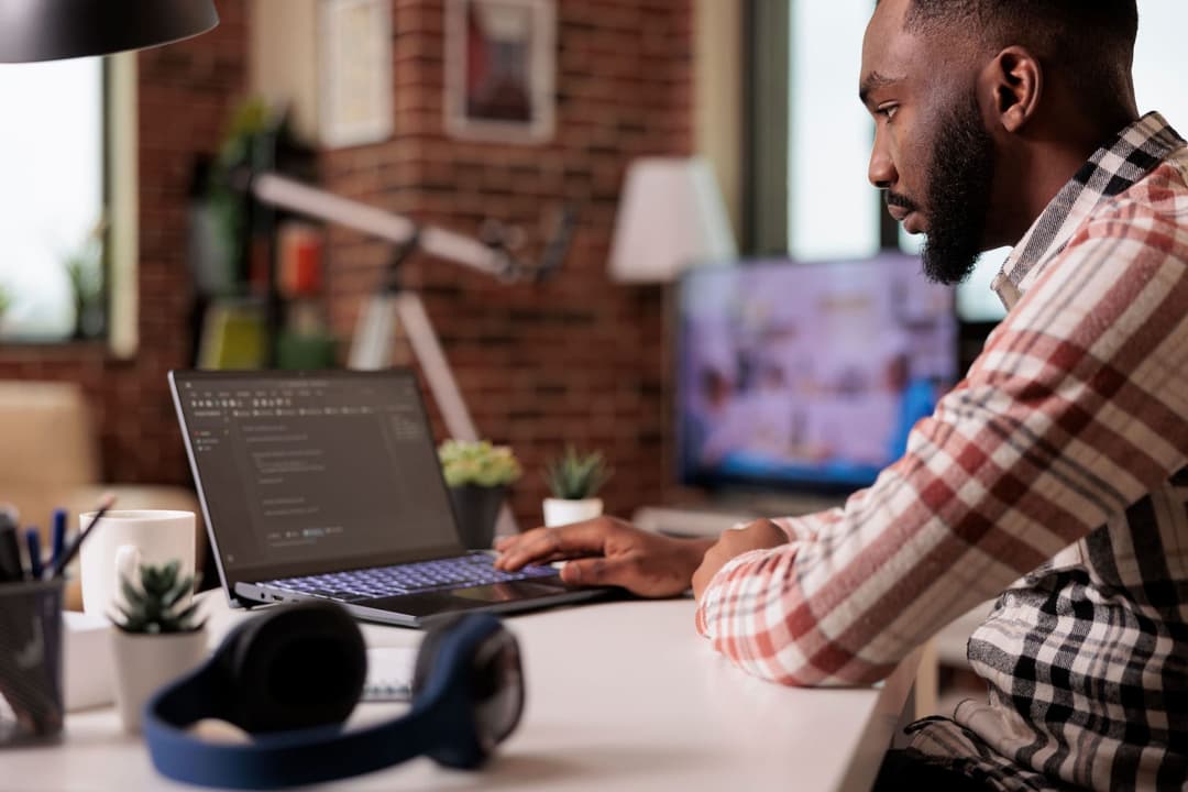 Software developer working on laptop